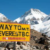A signpost next to the path to Mount Everest that reads "WAY TO M.T. EVEREST B.C."