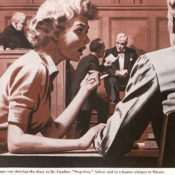 Woman talks to her lawyer during a trial