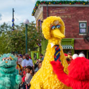 Sesame Street characters Big Bird, Elmo and a green monster are loose.
