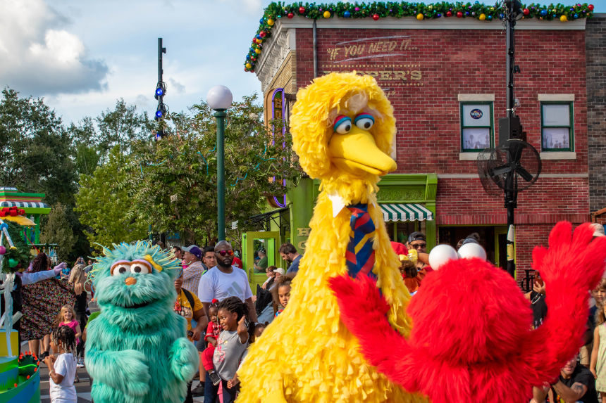 Sesame Street characters Big Bird, Elmo and a green monster are loose.