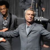 David Byrne and his band performs on stage