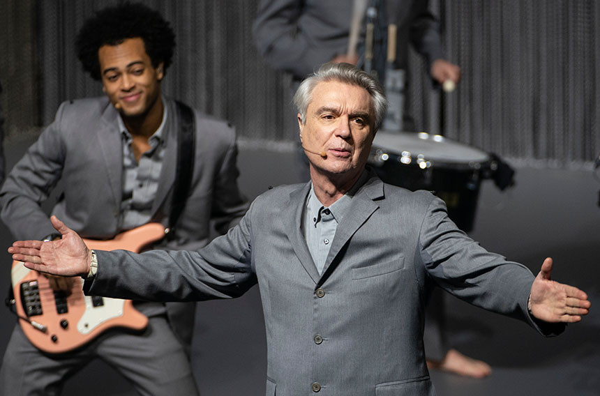 David Byrne and his band performs on stage