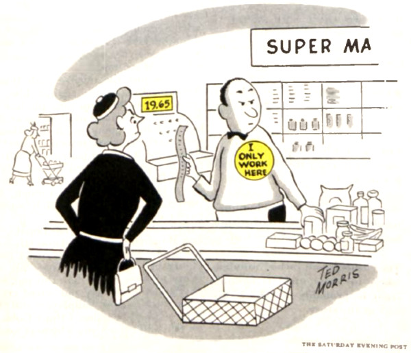 Grocer checks a shopper out at the cash register. 