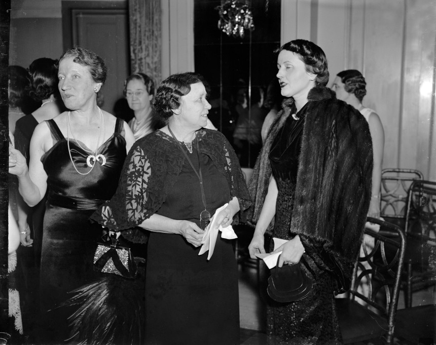 Hattie Wyatt Caraway speaks with a woman at a gathering.