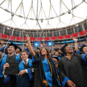 College graduates waving during commencement at Georgia State University