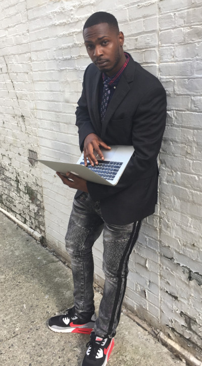 GSU graduate Princeton Nelson with his laptop