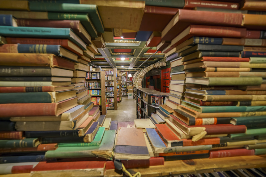 Books arranged in a tunnel formation in a book store.