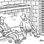 Two prisoners talking in a cell