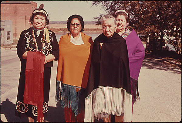 Women from the Iowa Indian tribe show off modern versions of their traditional dress.