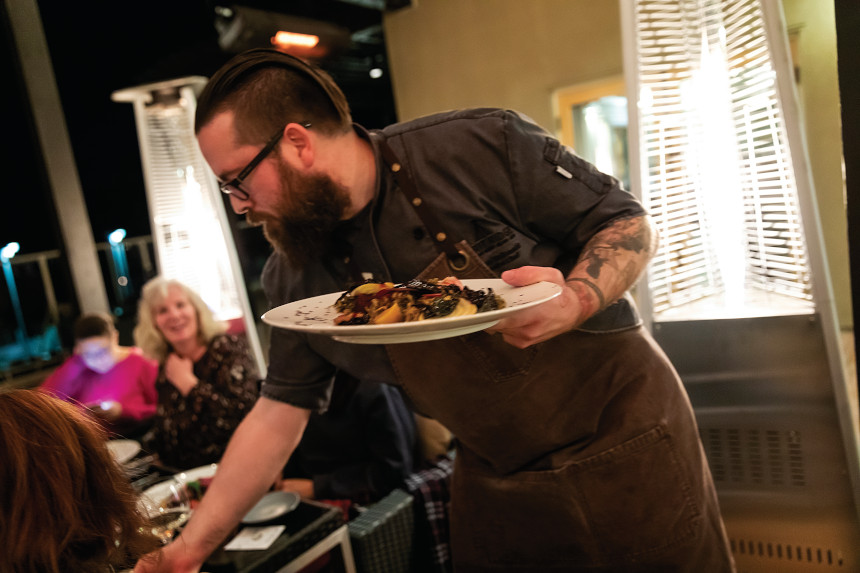 Chef Murray McDonald serves food in his restraunt