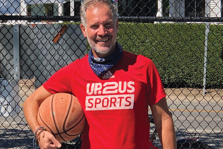 Photo of UP2US founder and CEO Paul Caccamo with a basketball
