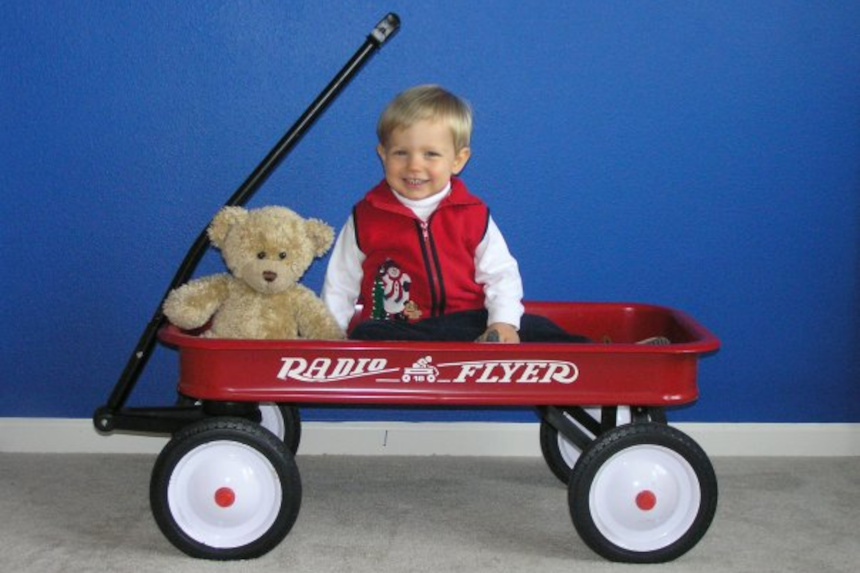 Troy Brownfield's son Conner in a Radio Flyer toy wagon