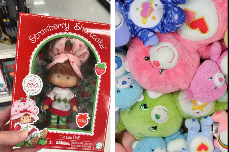 A strawberry shortcake doll and a pile of carebear dolls