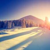 Sunrise over a snowy hill