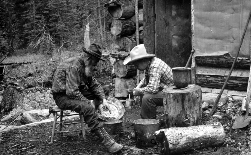 A pair of prospectors sorting through stones during the 1849 California Gold Rush