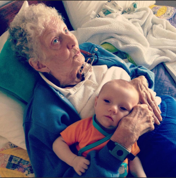 Photo of Lauryne Phyllis Noecker in bed with her grandchild.