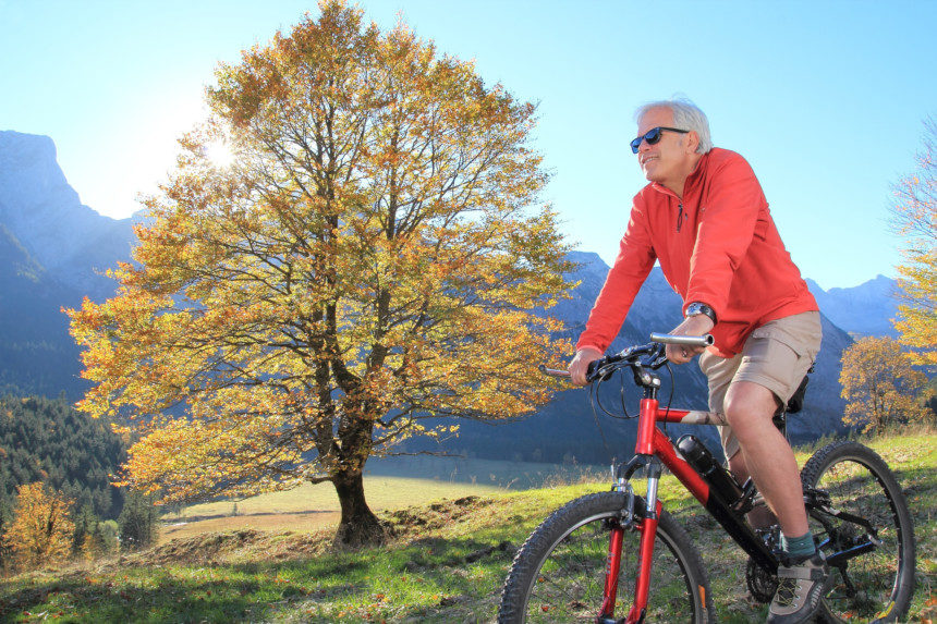 Older man on a bike.