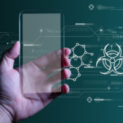 Man holding a smart phone in front of medical symbols