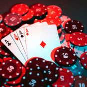 A poker hand rests on a pile of chips.
