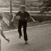 Two kids in the 1970s roller skating