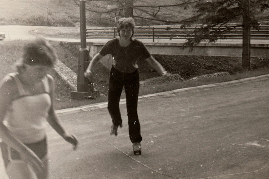 Two kids in the 1970s roller skating