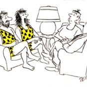 A visiting couple explain to their hosts why they are wearing cavepeople outfits