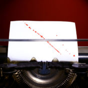 Typewriter with blood splattered on the inserted paper.