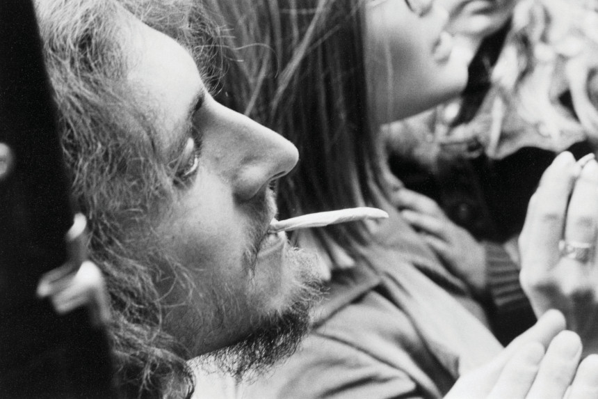 A man at a Grateful Dead concert smokes marijuana during a 1967 "smoke-in" at a concert.