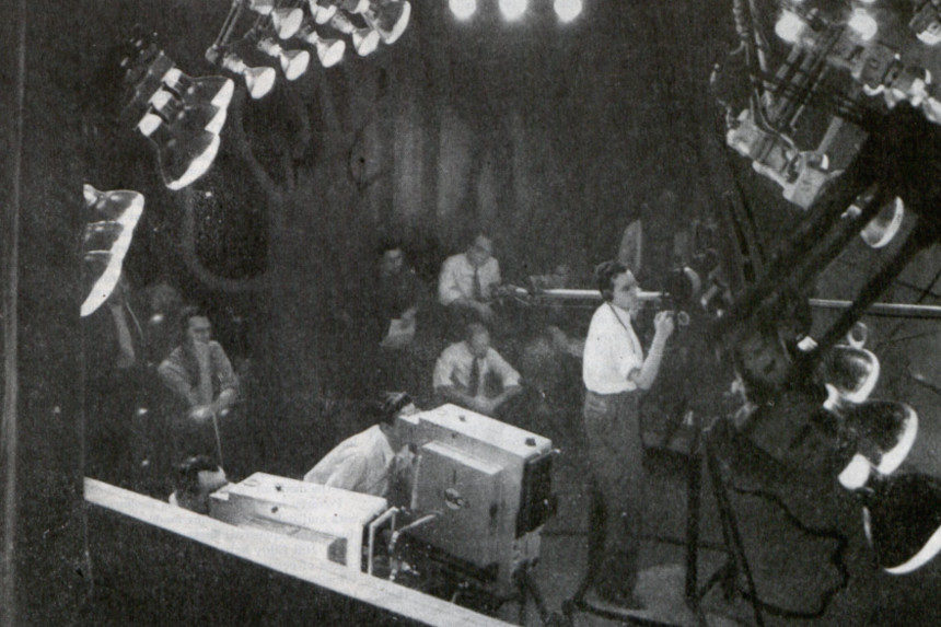 Staff setting up equipment in a television studio in the 1940s