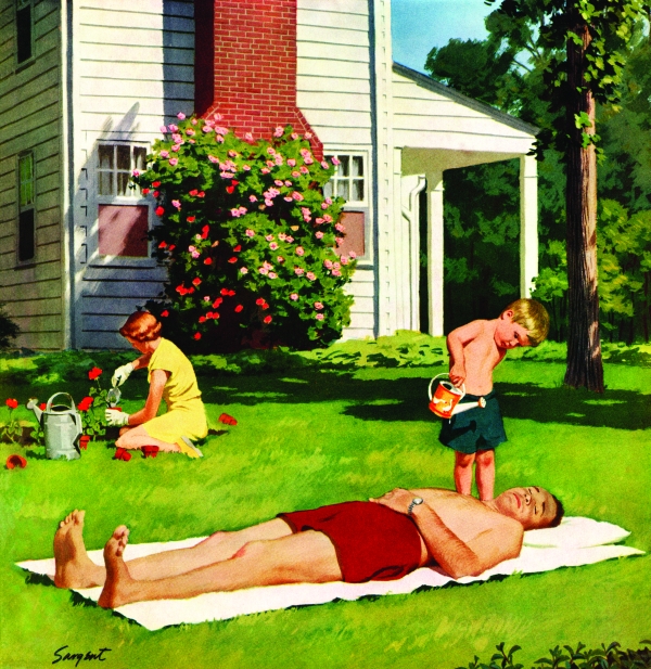 A young boy pours water on his father as the dad is sunbathing.