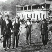 Miners surrendering their weapons to a federal soldier after the Battle of Blair Mountain, December 31, 1921 (https://libcom.org/gallery/battle-blair-mountain-1921-photo-gallery/ Wikimedia Commons, public domain)