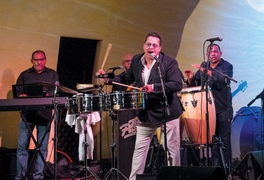 The Tito Puente Jr. Band performing on stage at the Ball & Chain bar.