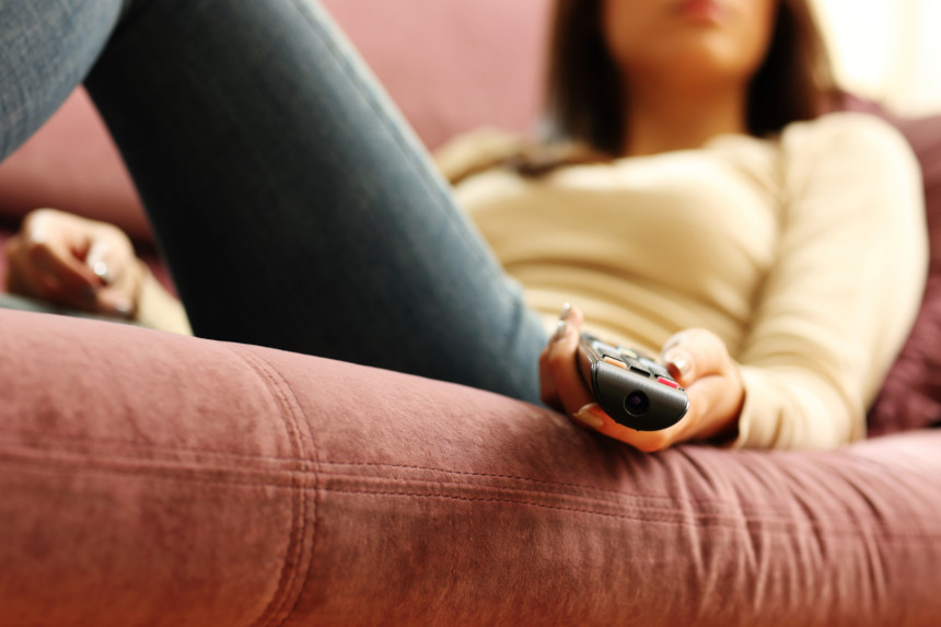 Woman holding remote control