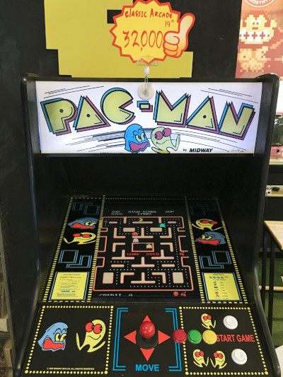 A vintage Pac-Man arcade cabinet