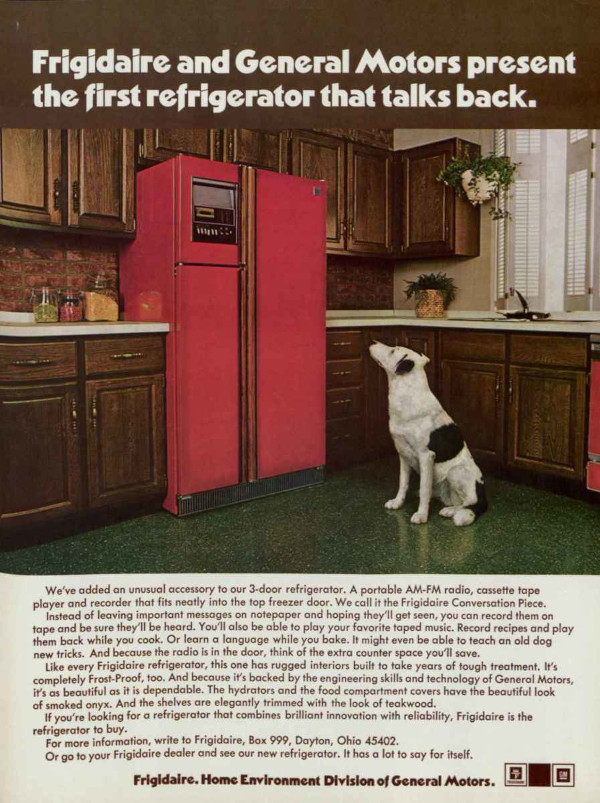 Dog looking at a fridge