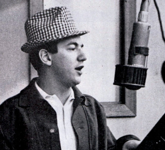 Bobby Darren singing into a studio mic