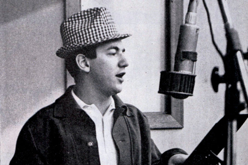 Bobby Darren singing into a studio mic