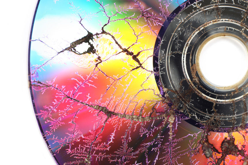 Close up of a cracked compact disc