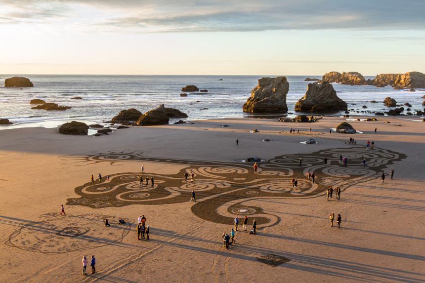 People navigate a sand labyrinth on the beach at Brandon By the Sea, Oregon