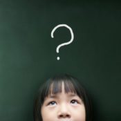 Young girl with a question mark over her head.
