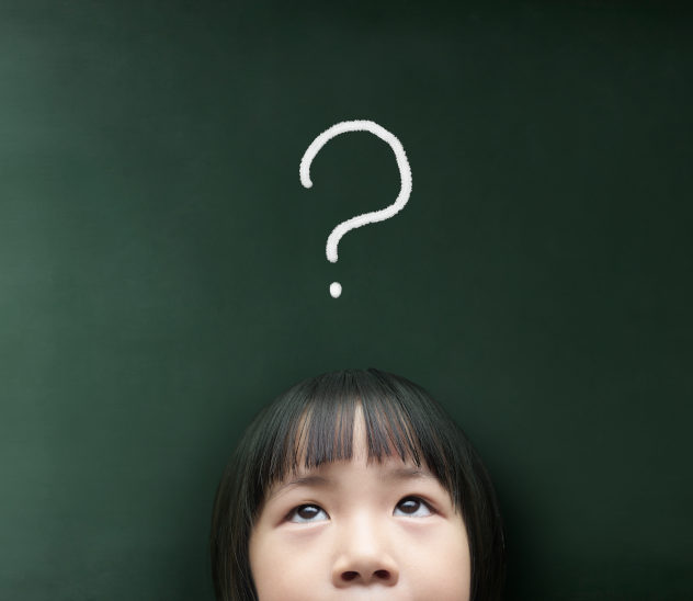 Young girl with a question mark over her head.