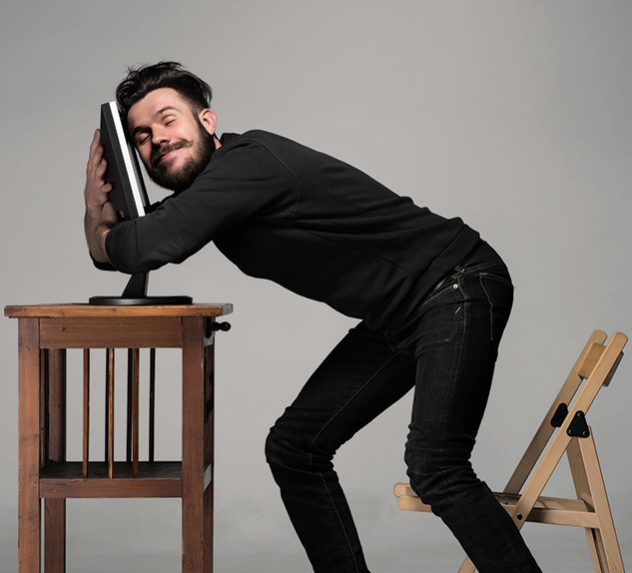 Man hugging his computer