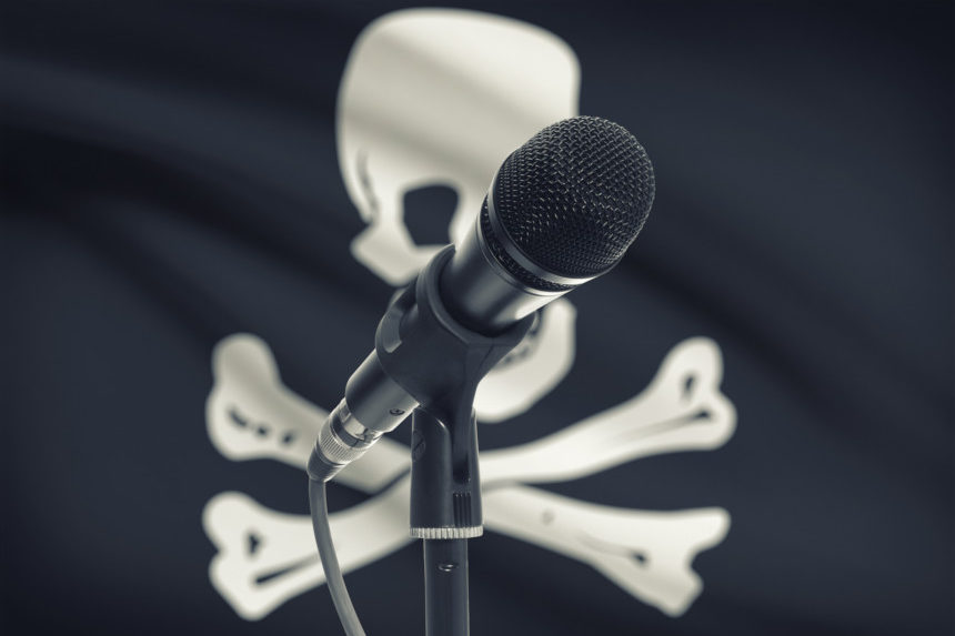 Microphone in front of a jolly roger flag