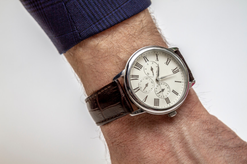 A wristwatch on a man's arm