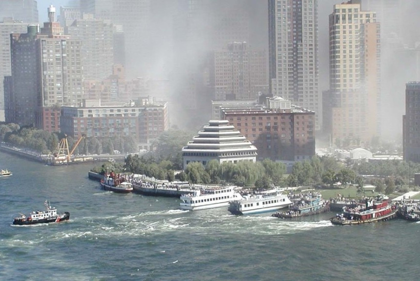 The emergency exit door slammed behind us, and I struggled to adjust to the bright sunlight after the dark stairwell. The sickening scent of something electrical burning filled my nostrils. Pieces of paper fluttered down like confetti at a ticker tape parade. Emergency vehicles screamed past as they sped up the West Side Highway.  Brian and I paused for a moment, catching our breath and trying to calm Gaby, our dog. As I watched men and women in suits and skirts sprinting past us, I suddenly realized I had no idea what I was wearing. I looked down: a pink knee-length cotton nightgown. Seeing a passenger jet slam into the South Tower of the World Trade Center had panicked me so much that I had run down 24 flights of stairs barefoot and in my pajamas. Regaining a slight bit of sanity, I turned to go back inside to get dressed, but the emergency door had locked. Standing barefoot on the sidewalk, feeling ever more vulnerable, I soon realized no one was going to notice what I was wearing. Everyone was in a panic, rushing directly into traffic, dodging cars, leaping over cement dividers. Abandoned briefcases, books, eyeglasses, purses, and shoes littered the street. “Here, wear my shoes,” my husband said as he sat down. “No, no,” I protested. “But let me wear your socks.” He peeled off his socks, I put them on, and walked in a little circle. “These are fine!” I said, not wanting him to worry. Forgetting my state of undress, I began plotting our next move, relying on my years of experience as a New York City tour guide to determine how to get as far away as possible from the World Trade Center. We were on the narrow southern tip of the island of Manhattan. Several roads led north, but they would take us right past the burning towers. “Brian, we have to get to Battery Park!”  Brian tightened his grip on Gaby’s leash and grabbed my hand. Hopscotching through traffic, we dodged ambulances and fire trucks on the West Side Highway. Finally, we broke through the last lane of traffic and stumbled into the haven of Battery Park. We joined a crowd gathered on the park’s northern border, watching more people arriving every moment. As soon as they reached the park, the newcomers would turn to look at the burning towers, a quarter mile away. Both were engulfed in huge black columns of smoke that made them look even taller and more formidable. Ripples of panic would wash through the crowd every time someone shouted rumors of more planes in the air or speculation about potential additional targets. Without warning, the ground began to shake, and a terrifying, otherworldly cracking sound of an avalanche filled my ears. Thousands of people began shrieking in terror as we realized that the unthinkable was happening: “A tower is falling!” People scattered like mice, sprinting blindly in every direction, dodging trees, hurdling over bushes, and catapulting over railings. The park had become a giant obstacle course. I froze in terror as a mass of something hit me in the face. It felt like someone had thrown a bucket of sticky sand over me: gunk filled my nose and mouth, covered my pajamas, and coated every pore of my unprotected skin. I opened my eyes slowly, trying to protect them from whatever was on my eyelids. Brian hadn’t moved, but he looked completely different — like an upright mummy. “What is this? Where’d it come from?” I sputtered, spitting out gunk. “I think it’s the tower,” Brian said. I looked around as dust filled the air. I felt like I was trapped inside a yellow-hued snow globe. We turned and ran south until we arrived at the water’s edge. We had run out of room to run. As we looked out onto the harbor that stretched before us, others sank to the ground in anguish or continued to run around in a senseless hysteria. One man ran past us and leapt over the banister at the edge of the park, ready to dive into the deep water. Tugging on Brian’s shirt, I asked, “Hey, what do you think? Could we swim it?” I gazed across the relatively calm waters. “Governor’s Island is probably a mile away,” Brian said. “I’m not sure we could swim that far.” “Yeah, and anyway, we have Gaby,” I said, looking at our now-yellow Boston terrier, who was desperately trying to lick the dust off his black fur. “Hey, what about the Staten Island Ferry?” We turned left and hurried toward the terminal, and my heart lifted when we spied the giant orange vessel docked in the ferry slip. We joined the tail end of a crowd bottlenecking at the glass entrance doors, but as we approached the terminal, a man burst out of the nearby exit. “It’s not running! It’s been abandoned!” Devastated, we stopped in our tracks, unsure what to do next, when the crowd began shrieking again. The wind had changed direction, blowing thick clouds of smoke toward us. I held my thin cotton nightgown over my nose and mouth but inhaled soot and smoke with every breath. The smoke stream from the towers stretched all the way south to the terminal, completely engulfing it. The thick wall of deadly smoke threatened to asphyxiate us all, cutting off any path that led east. As we hesitated, the crowd that had been pushing to get to the ferry terminal reversed to escape this new threat. Afraid we would be trampled, we turned and tried to outrun the pack. We ran west, away from the smoke, until Brian suddenly veered north, heading toward the old Castle Clinton fort. We hugged its stone wall, trying to catch our breath. Gaby flopped on the ground, exhausted. We couldn’t bear to go further north as each step beyond the fort meant a step closer to the epicenter of danger. We were running out of options. “Brian, is this it? Are we going to die?” He hesitated, then looked me in the eye. “I don’t know . . . maybe,” he said. He took my hands in his and began praying out loud. The cries of people near us filled my ears. Barefoot, covered in yellow dust, my husband and I said good-bye to each other. But after resting for a few minutes, Brian had another idea. Holding his shirt over his nose and mouth, he said, “Let’s move up the coastline. If we stick to the Battery Park Esplanade, maybe we can walk our way out of this.” I followed Brian and Gaby up the waterfront, passing the rotting Pier A at the northwestern edge of Battery Park and crossing into Wagner Park, where we suddenly caught glimpses of a pristine blue sky. Upwind of the smoke and the ceiling of yellow dust, the air was clear. Near the Museum of Jewish Heritage, on the shore of the Hudson River, we saw about 50 people gathered around two large weeping willow trees. We had gone as far as possible, our escape route to the north blocked by the North Cove Yacht Harbor and World Financial Center, just across the street from the World Trade Center. It was just as well; we were too exhausted to go another step. Brian and I sank down on the lawn under one of the willows, which I had always loved. Now, sticky grime covered their long branches, making them look like ghoulish Halloween decorations. Suddenly a dust-caked man appeared, yelling, and waving his arms as he ran toward us. “The second building is coming down! Run to the river and turn your backs to it!” We leapt to our feet and ran to the bank of the Hudson, crouching low to the ground next to a curved railing. If the tower fell in this direction, we would be right in its path. Within moments, the second tower collapsed with another thunderous roar. We hunkered down, waiting for the fallout—for the cloud of gunk and dust—but it never came.  We slowly regrouped with the others who had taken cover near us, lingering next to the railing and looking out at the Hudson River. There was nowhere else to go. Rescue Fire boats were zooming up the Hudson. As they passed, people in the crowd would yell at them, begging them to stop and help us. As the boats zoomed on by, seemingly oblivious, terror began turning into rage. One businessman with torn pants and a bloodied, white shirt shook his fist in the air and screamed, “Come over here and f***ing get us!” Watching such rage just made me feel more hopeless. Then I noticed a line of people forming farther down the path we had been following. “Brian, look over there. What’s that about?”  He squinted. “Not sure. I can’t tell from here.” I gazed out into the river and recognized the outline of a tugboat. I watched as it got closer and closer to the shore — much closer than the fire boats that had been passing. “Oh my gosh, I think that boat’s coming to dock!” Brian exclaimed. The tugboat approached the railing and men threw ropes to secure the boat. Brian and I ran to join the line of people near the boat, but I quickly realized it was way too small to take all of us. After loading about 50 people, the tugboat backed up and left.  We had no other plans for getting off the island, so we decided to stay where we were and hope the tugboat would return. I sat down, ready for a long wait. But it was only a few minutes before we saw another, much bigger boat approaching. It was a large white NY Waterway boat, a ferry that travels between New York and New Jersey. And it was coming to get us! As it pulled up alongside the railing, I became acutely aware this was not a loading zone. We were on a pedestrian walkway surrounded by a four-foot-high safety railing, and the deck of the boat was about seven feet below the top of the seawall. In other words, there was a big gap between the top of the safety railing and the deck of the ferry. As a tour guide who routinely took groups of tourists to the Statue of Liberty, I knew there was a procedure to safely load boats, and I knew there was no way to safely board from this spot. I was shocked the captain would even try it here.  As the captain brought the ferry closer to the shoreline, I saw two large, muscular men tie up the boat and then turn their attention to the waiting crowd. Judging by their uniforms, these guys were dockhands who ran the ferries to the Statue of Liberty.  With no ladder or ramp to span the gap between the walkway and the deck, the dockhands began helping people over the rail and lowering them into the boat. It was awkward and slow — and definitely did not meet New York City’s stringent safety rules — but it was working.  Brian was in front of me carrying Gaby. When it came our turn to board, one of the big men asked, “Does that dog bite?” Brian shook his head, and a deckhand in the boat raised his arms. The dockhand took Gaby from Brian and tossed him gently to the man below. Then it was my turn. I climbed up on the railing and sat with my legs dangling over the edge. The dockhands gave me a few seconds to balance before lowering me down toward the deck. “Hey man, watch the lady’s skirt,” one said to the other.  I looked down and realized my pink nightgown barely covered my knees. But I was way beyond being caring about my clothes or my modesty. The guys took my forearms and lowered me into the boat, keeping my nightgown clamped tight around my legs. Brian climbed over the railing and jumped down to join us. As Brian retrieved Gaby, he asked one of the guys, “Where is this boat going?” “Jersey City.” Slipping into “tour guide” mode, I led Brian and Gaby through the interior passageways and up the short staircase to the open-air top deck, where I always took my groups so they could capture the best photos of the Statue of Liberty. As we made our way to our seats, I took stock of the other evacuees. There were about 200 on board — office employees, hotel staff, women in workout clothes, parents with kids, and mothers holding babies. All seemed bewildered to find themselves floating on a ferry in the Hudson on what had started out as a normal Tuesday morning.  Some appeared unscathed, as if they had been nowhere near the chaos. Others were yellow from dust, like Brian and me. A few were red from blood. Clothing ranged from pristine to shredded. I tried not to stare at a blood-soaked man whose clothes had more gaping holes than intact material. He sat alone, staring straight ahead in shock. Many people were crying, and several wore the wide-eyed panicked look I had seen much of the morning. A few managed to pull off the impassive expression of a normal New Yorker during a normal morning commute, like it was just an ordinary day. One thing we all had in common — no one was talking. And no one had their cell phones out as cell service was down. Brian and I collapsed onto a bench, and Brian gathered Gaby onto his lap. It felt so good to sit down. When the boat reached capacity, the dockhands pushed off from the wall, assuring the people waiting in line that more boats were coming. As the ferry started churning through the water, I gazed back at the city we were leaving behind. A large cloud of dust hung over the Twin Towers — or the spot where they had been — and stretched to the end of Battery Park and floated out into the harbor. From this angle, the dust took on a white hue instead of the yellow shade that had settled on our clothes. Thick black smoke rose from the gaping empty hole. I turned my head away. According to the watch on Brian’s wrist, it was almost noon. After three hours of terror, we were off the island. We were alive. As we set out across the river, I looked across the harbor. Boats of all shapes and sizes were racing toward Manhattan from every direction. I had never seen so many boats sailing through the waterways at once. As we stepped ashore in New Jersey, I looked back at my beloved city, shrouded by a massive yellow, white, and black cloud. We unloaded quickly, and without a backward glance, our captain and his crew turned the boat around and headed back to Manhattan. The Largest Modern Day Boat Evacuation I later learned that Brian and I were just two of the approximately 500,000 people rescued from the island of Manhattan by boat that day. The September 11 boat lift would prove to be the largest sea evacuation in recorded history, surpassing even the “Miracle of Dunkirk,” the rescue of Allied soldiers from the coast of France during World War II. The terrorist attacks had left up to a million people stranded in Manhattan. Immediately after the attacks, subway trains were shut down, and after the second plane hit, the city closed all bridges and tunnels to Manhattan to nonemergency traffic. MTA buses were suspended or rerouted. With tunnels closed and subways shut down, workers and residents south of Canal Street found themselves fleeing on foot, picking their way through streets littered with dust and debris from the collapsed buildings. Like Brian and me, hundreds of thousands headed to the coastline as they fled the devastation. When the U.S. Coast Guard realized that large crowds were gathering there, they issued a radio call asking every available boat to head toward the tip of Manhattan to take people off the island. In a virtual panel discussion in 2020 hosted by the Transportation Institute, the New York Council Navy League, and Turnstile Tours entitled, “The 9/11 Boatlift: Panel Discussion with Maritime Heroes,” Dan Ronan, former Director of Vessel Trafficking Service of the U.S. Coast Guard Sector New York, said, “We made the conscious decision that we wanted the professional mariners of New York — of which there are many and who are very talented — to be that workforce to move people that day.” The Coast Guard was not sure who would respond, but an estimated 150 boats soon headed toward Manhattan. New York Harbor quickly filled with sightseeing boats from Circle Line Tours, NY Waterway ferries, tugboats, water taxis, privately owned dining boats, personal watercraft, fishing boats, and party boats. Some of them went back and forth across the harbor all day, dropping off passengers in New Jersey, Brooklyn, Staten Island, and upper Manhattan. In a report prepared for the U.S. Department of Transportation that details how the transportation system was affected on the day of the attacks, the NYPD stated, “While the evacuation of Lower Manhattan was chaotic, it was an ‘interesting phenomenon.’ It happened almost as if it were rehearsed, but no one had ever planned for it.” A true cross-section of New York City demographics was evacuated by boat that day. Approximately 300,000 office workers, including commuters from New Jersey, Connecticut, and Pennsylvania, along with 25,000 residents and 50,000 students, were downtown that Tuesday morning. Nobody knows how many tourists were in the Financial District that morning, but there certainly were many, as it’s known 35 million visited the city that year. Peter Johansen, former Director of Operations, New York Waterways, commended the evacuees for their behavior in the panel discussion. “People were great. They were very cooperative. They were being polite to each other. There was no pushing, no shoving, anything like that.” The spontaneous boat evacuation of 9/11 helped rescue 500,000 people in less than nine hours. “Every mariner is taught that you never, ever leave someone out there. If someone calls for help, you go. It’s ingrained in every mariner. It’s the real basis of why everything happened,” said panelist Andrew McGovern, Sandy Hook Pilots Association. Vice Admiral Michael McAllister, Deputy Commandant for Mission Support, United States Coast Guard, and also part of the panel, stated, “When I think about the role of the maritime industry . . . they saved a lot of lives by conducting a safe and rapid evacuation of the island of Manhattan.” On September 11, my focus was on escaping the island, and I never thought to get names of the men who took such care loading me onto the ferry that day. And it would be years before I understood the scale of the boat evacuation and realized there were at least 800 maritime heroes that day. Unfortunately, many involved in that boat evacuation have since died, as the toxic dust they inhaled during the rescue mission eventually led to cancer or other illnesses.  We Will Never Forget If it weren’t for the maritime heroes, that day would have played out much worse for hundreds of thousands of us. We were the lucky ones. Over the past 20 years, we have had opportunities to continue life and to pursue our dreams, unlike almost 3,000 others whose lives were cut short on 9/11. On a day that saw the worst of humanity, we also saw some of the best. And we will never forget them. Featured image: Boats coming to the rescue of hundreds of thousands of people who were stranded on Manhattan on September 11, 2001 (Courtesy New York City Police Department)