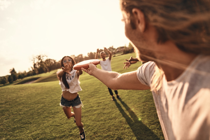 Young people playing frisbee