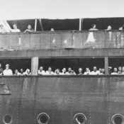 Jewish refugees look out aboard the MS St. Louis