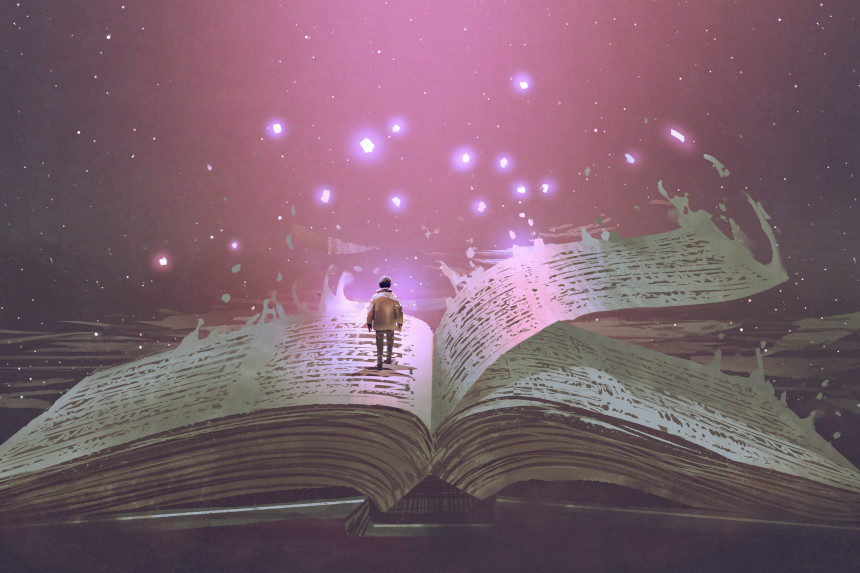 A small boy walks on the pages of a large, open book.