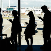 People lining up to board a plane at the London Heathrow airport