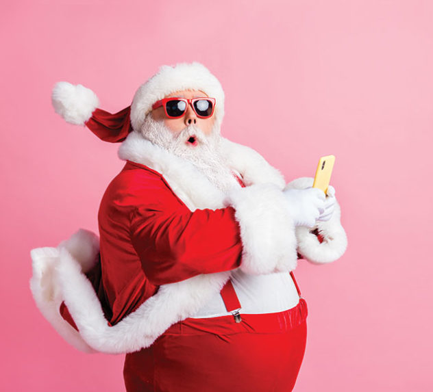 Santa Claus in front of a pink background